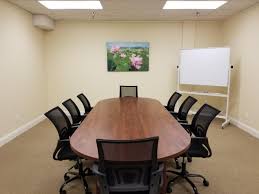A conference room with chairs and tables in it